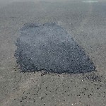 Pothole at 5840 Trojan Ave